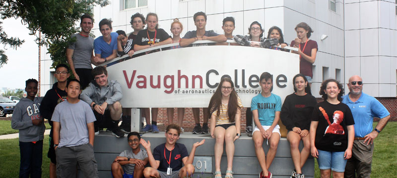 TryEngineering Summer Institute students pose in front of the Vaughn College of Aeronautics and Technology sign on campus, just one of the premier campuses where our summer engineering programs are offered