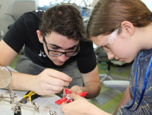 TryEngineering Summer Institute students participating in our summer engineering programs participate as a team in a hands-on design challenge